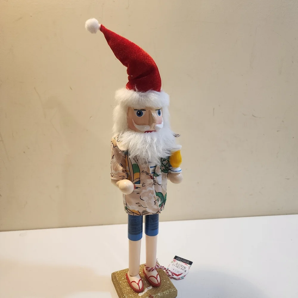 Wooden nutcracker styled as a Beachy  Santa Claus W/floral shirt, sunglasses